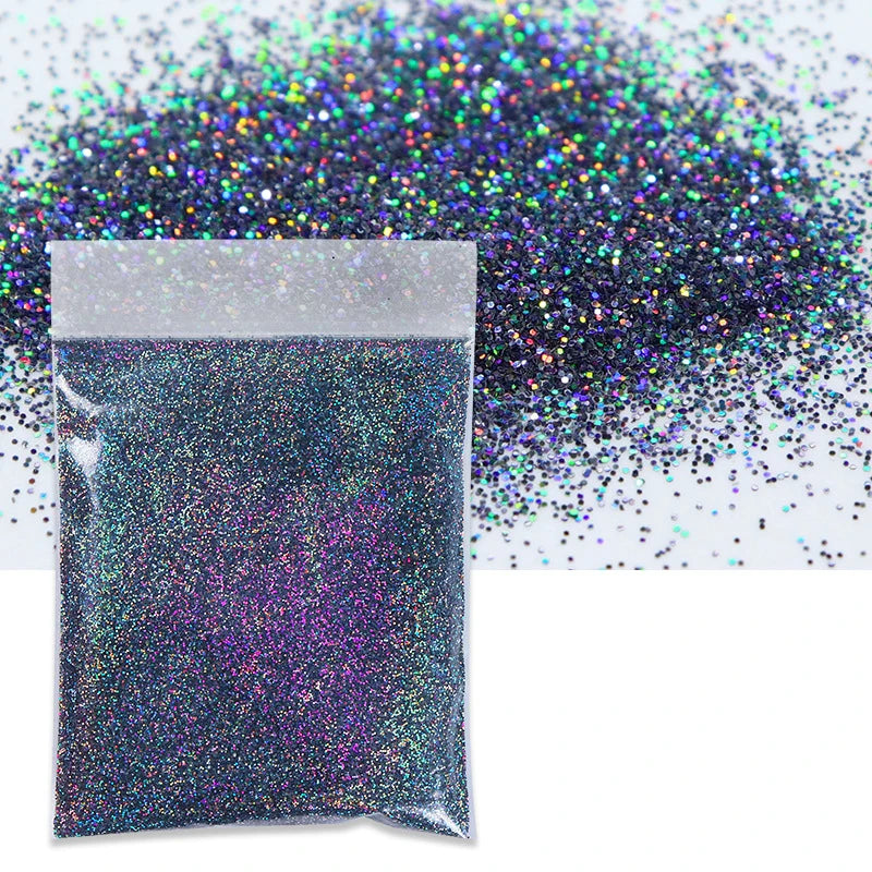 A small plastic bag filled with iridescent purple glitter powder next to a pile of loose holographic glitter.