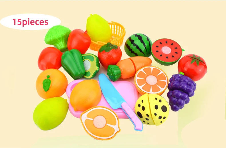 A set of 15 pretend play cutting food toys including various fruits and vegetables like apples, tomatoes, and citrus slices.