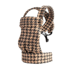 A beige patterned cotton baby carrier wrap with a padded shoulder strap and adjustable features.