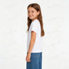 A smiling girl wearing a white short-sleeved t-shirt and blue jeans.