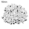 A pile of small white plastic safety eyes for crafting and stuffed animals