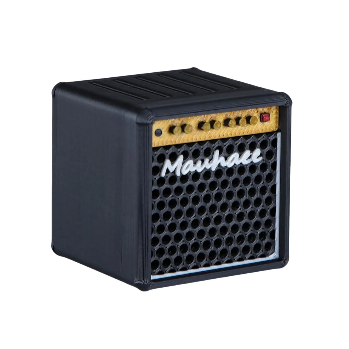 A black guitar pick holder with a speaker-shaped design featuring a perforated grille and a nameplate.