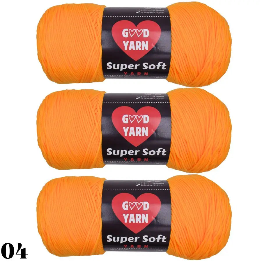 Three balls of bright orange Super Soft yarn labeled GVD YARN for crochet and knitting