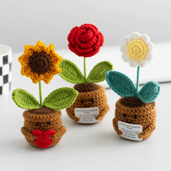 Handmade crochet emotional support plants with colorful flowers and leaves