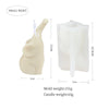 A small, light-colored silicone mold shaped like an elephant for making candles, soap, or resin crafts.