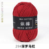 A ball of deep red milk cotton yarn labeled with Chinese characters and a number 29