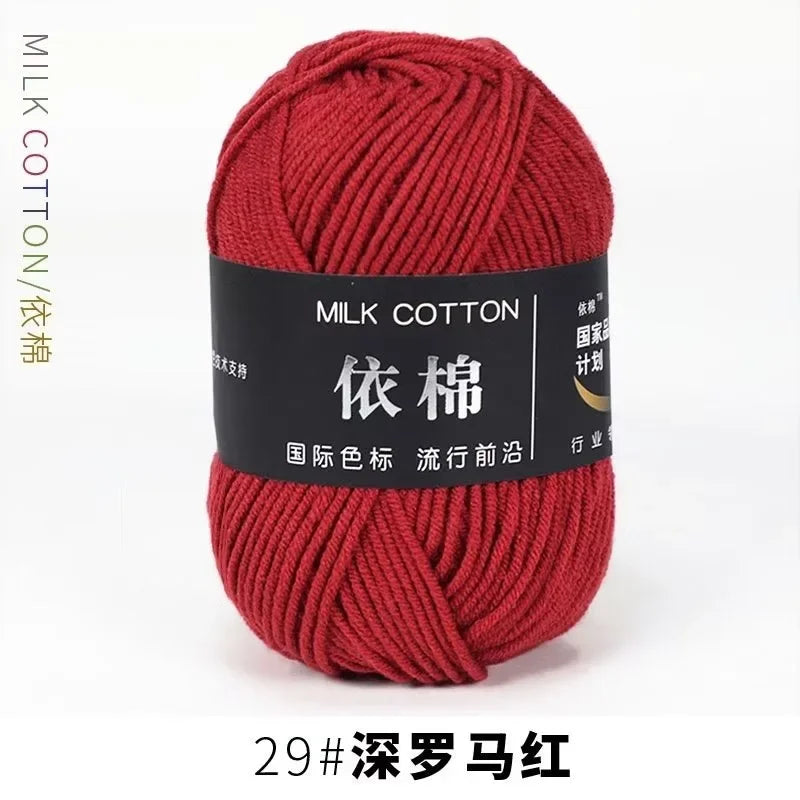 A ball of deep red milk cotton yarn labeled with Chinese characters and a number 29