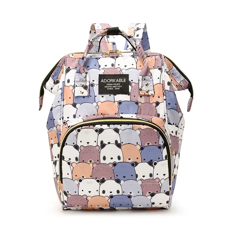 A pink and gray cartoon bear print waterproof diaper bag with a shoulder strap.