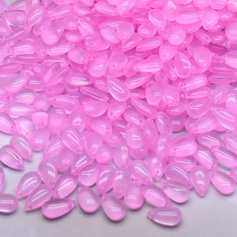 A pile of pink water drop Czech glass beads for jewelry making
