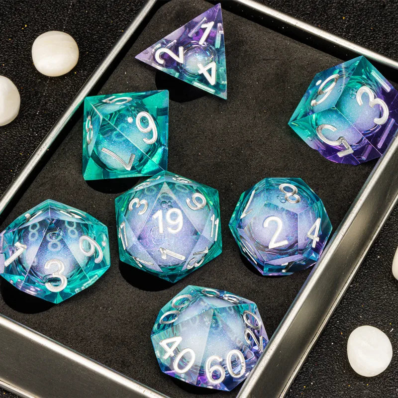 A set of liquid core dice in various colors and angles displayed on a dark tray.
