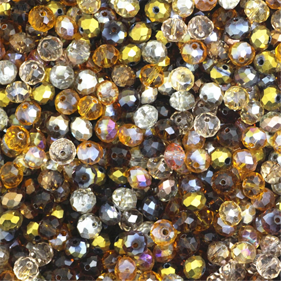 Multicolor round crystal glass beads used for jewelry making, featuring various shades of amber and clear glass.