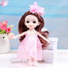 A 17cm articulated princess doll with long brown hair and a pink dress, sitting in front of a white piano.