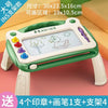 A green magnetic drawing board for kids featuring a white pad with a duck drawing and various colored markers.