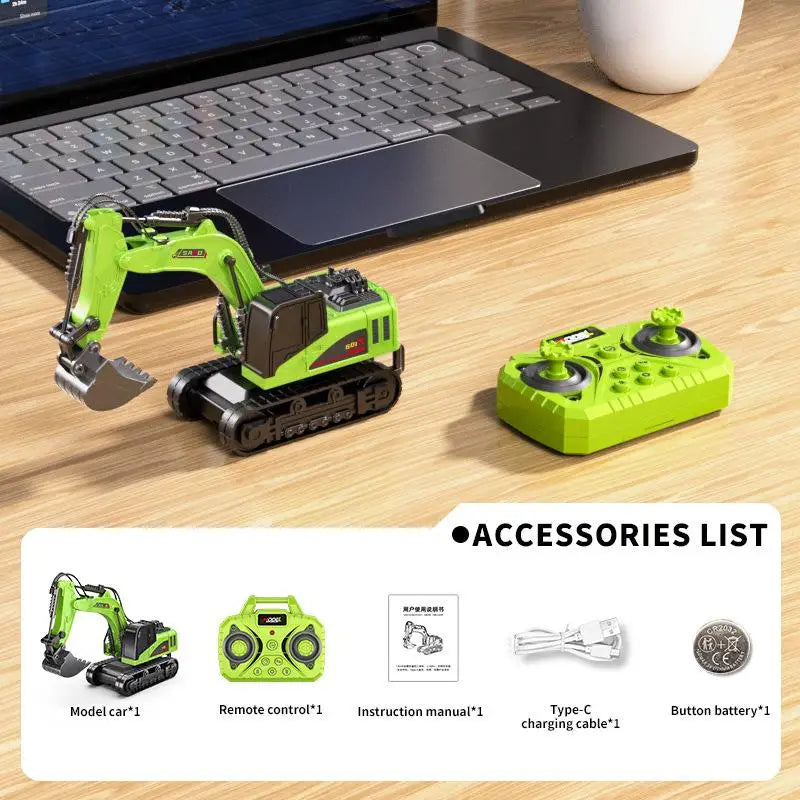 A green mini RC forklift truck model with accessories laid out on a wooden surface next to a laptop.
