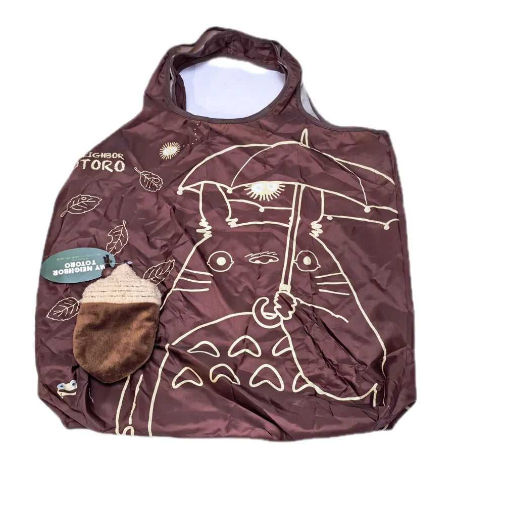 A brown fabric bag featuring a line drawing of a hippo and a small brown plush toy.