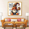 A framed painting featuring a whimsical gnome character with a beard and hat surrounded by autumn foliage.