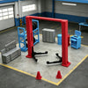 A 1/64 scale mini garage diorama featuring red and blue tools and equipment on a gray floor.