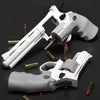 A white spring-powered revolver dart blaster with a gray grip and soft foam ammo is shown in various angles.