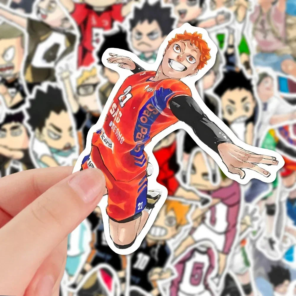 A hand holds an orange-haired anime character sticker from the Haikyuu sticker pack.