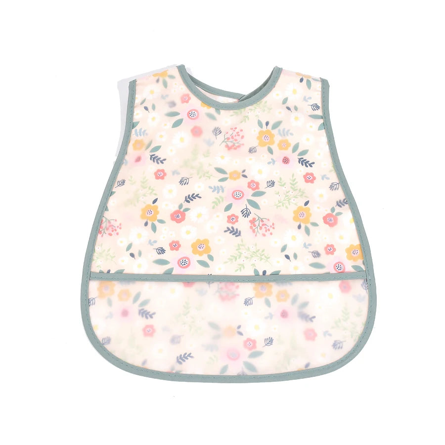 A light pink and green cartoon floral pattern waterproof baby bib for toddlers.
