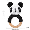 A cute panda-shaped wooden rattle and teether ring with black and white fur texture.