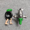A set of two Italian Brainrot wooden stick doll figures, one green and one silver, against a gray background.