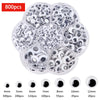 A clear plastic container filled with various sizes of self-adhesive moving eyes for crafts and DIY decorations.