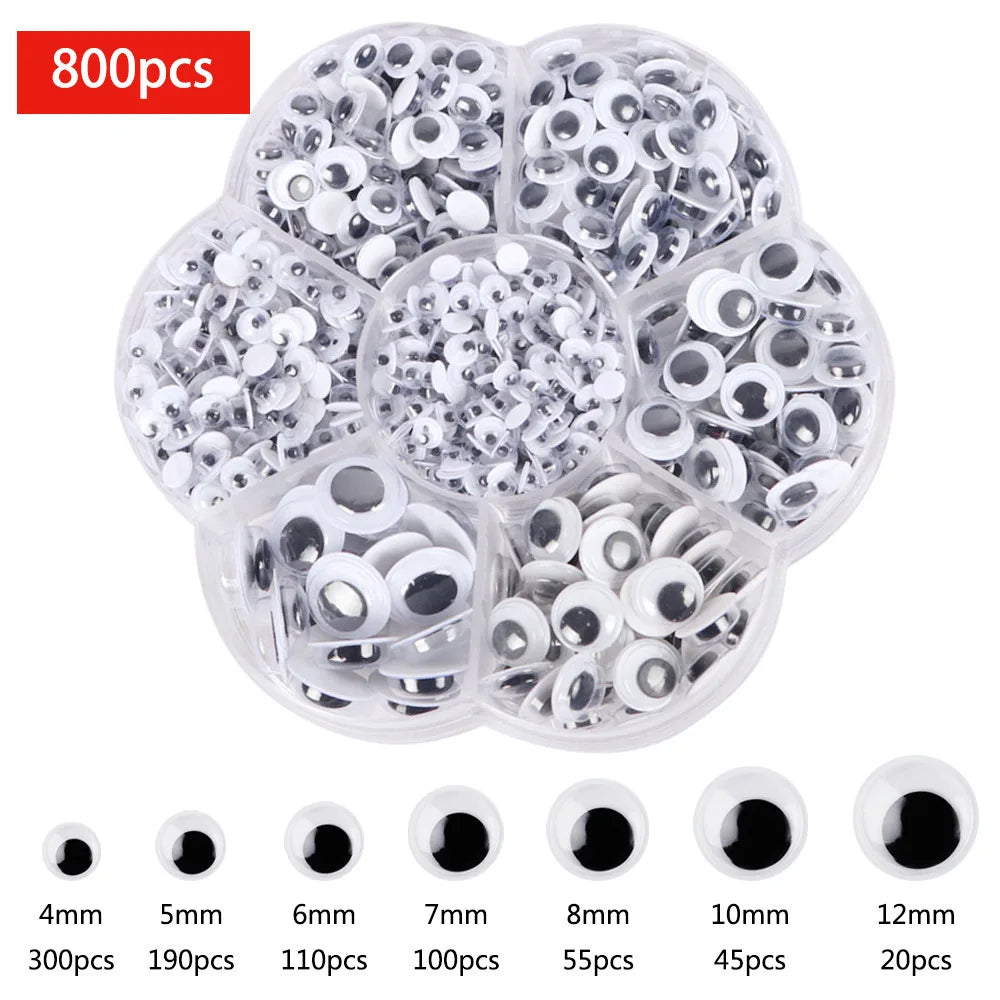 A clear plastic container filled with various sizes of self-adhesive moving eyes for crafts and DIY decorations.
