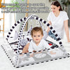 A mother is shown using a multifunctional baby play mat with a fitness frame and hanging toys for a baby.