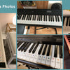 A collection of piano keyboard note stickers for white and black keys displayed on various keyboards.
