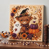 A framed canvas featuring a detailed painting of a brown goat with horns surrounded by autumn flowers and a ghost figure.