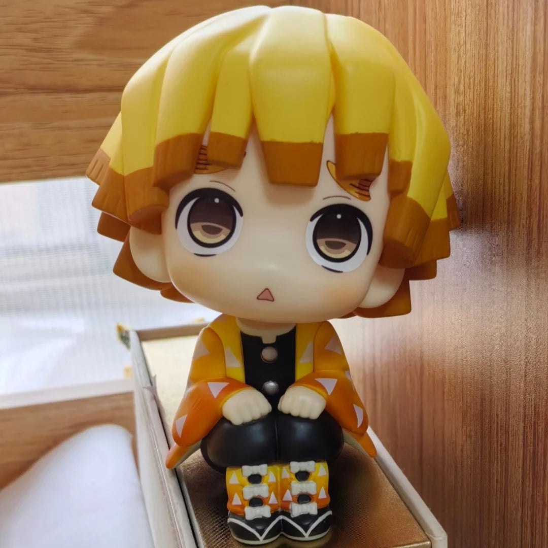 A figure set of Tanjiro and Nezuko from Demon Slayer, featuring yellow hair and orange clothing.