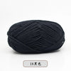 A ball of black pre-dyed milk cotton yarn for knitting and crochet.