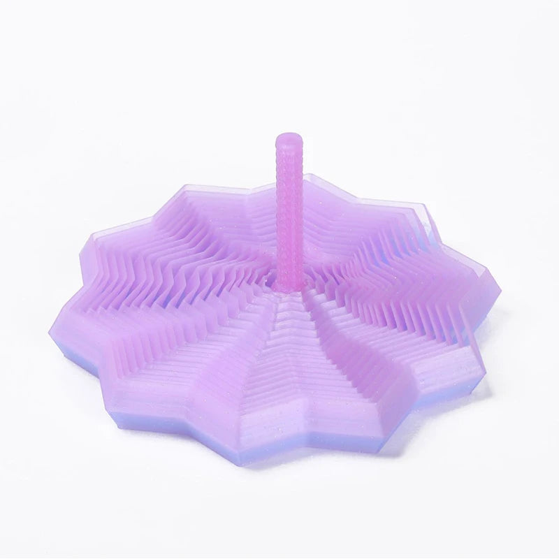 A translucent purple 3D illusion fidget star with radiating ridges and a central peg.