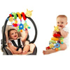 A baby is playing with a musical spiral crib toy featuring colorful rattles and spinning action toys.