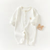 A white ribbed soft cotton baby romper for newborns and infants with a small bear embroidered on the chest.