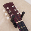 A dark red acoustic guitar is shown mounted on a wall hanger with tuning pegs visible.