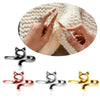A set of adjustable cat-ear yarn guide rings in silver, rose gold, and gold colors shown with a hand knitting yarn.