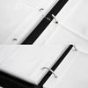 Close-up view of a white PU leather card binder with a black zipper and silver hardware.