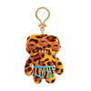 A 12 cm Fuggler Funny Plush Monster Keychain with a yellow and black leopard print rabbit design.