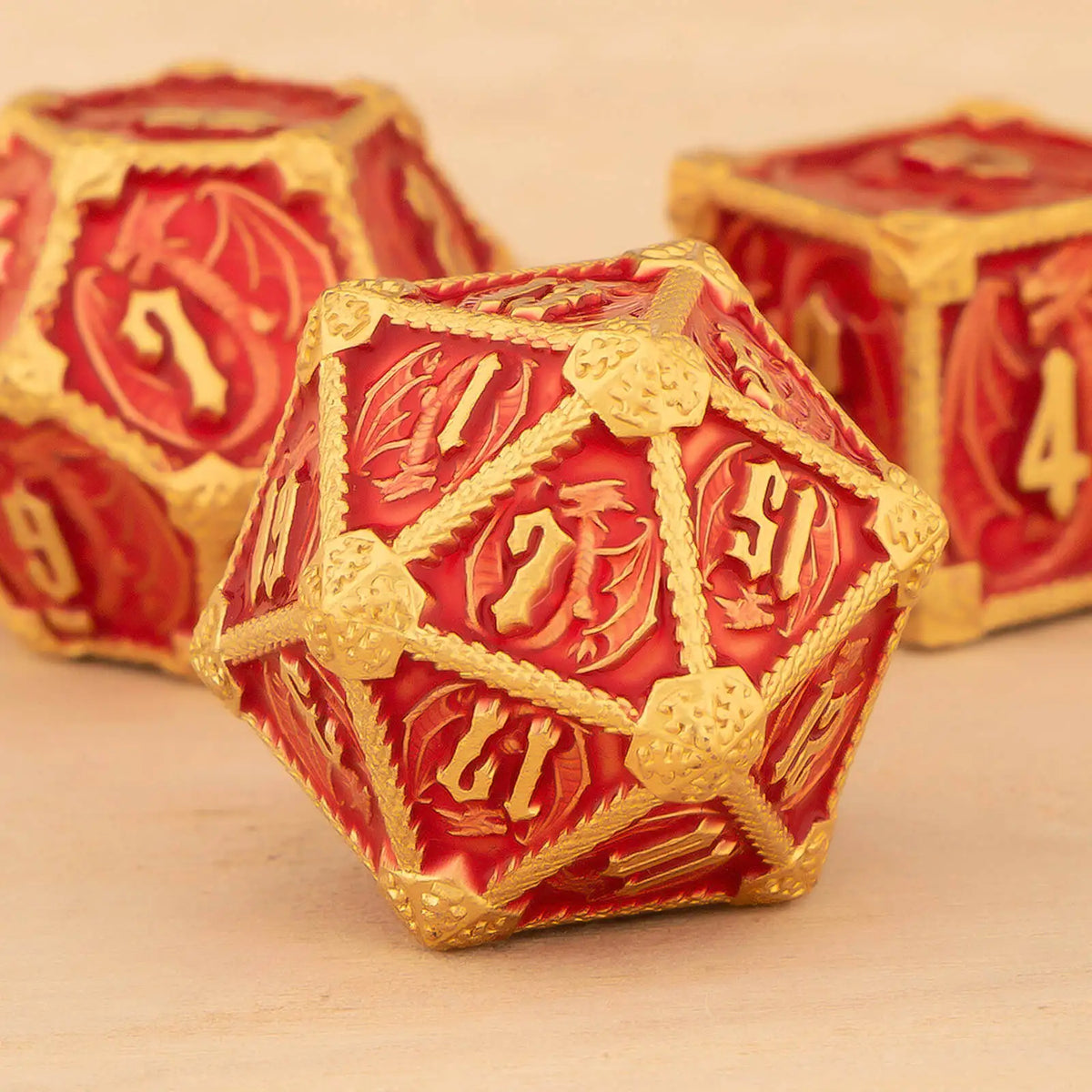 A close-up of a red and gold polyhedral dice set, including a d7, resting on a wooden surface.