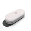 A white, oval-shaped EDC push slider fidget toy resting on a light surface.