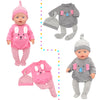 A pink doll outfit set for a baby featuring a pink long-sleeved top and striped pants with a gray accessory.