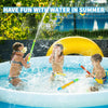 A child is playing with a water blaster in a blue pool outdoors during summer fun.