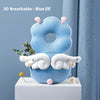A blue elf shaped soft silicone head protection pillow with white wings and green leaves displayed on a white surface.