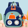 A light green backpack featuring an orange digger truck design with circular and gear-like emblems.