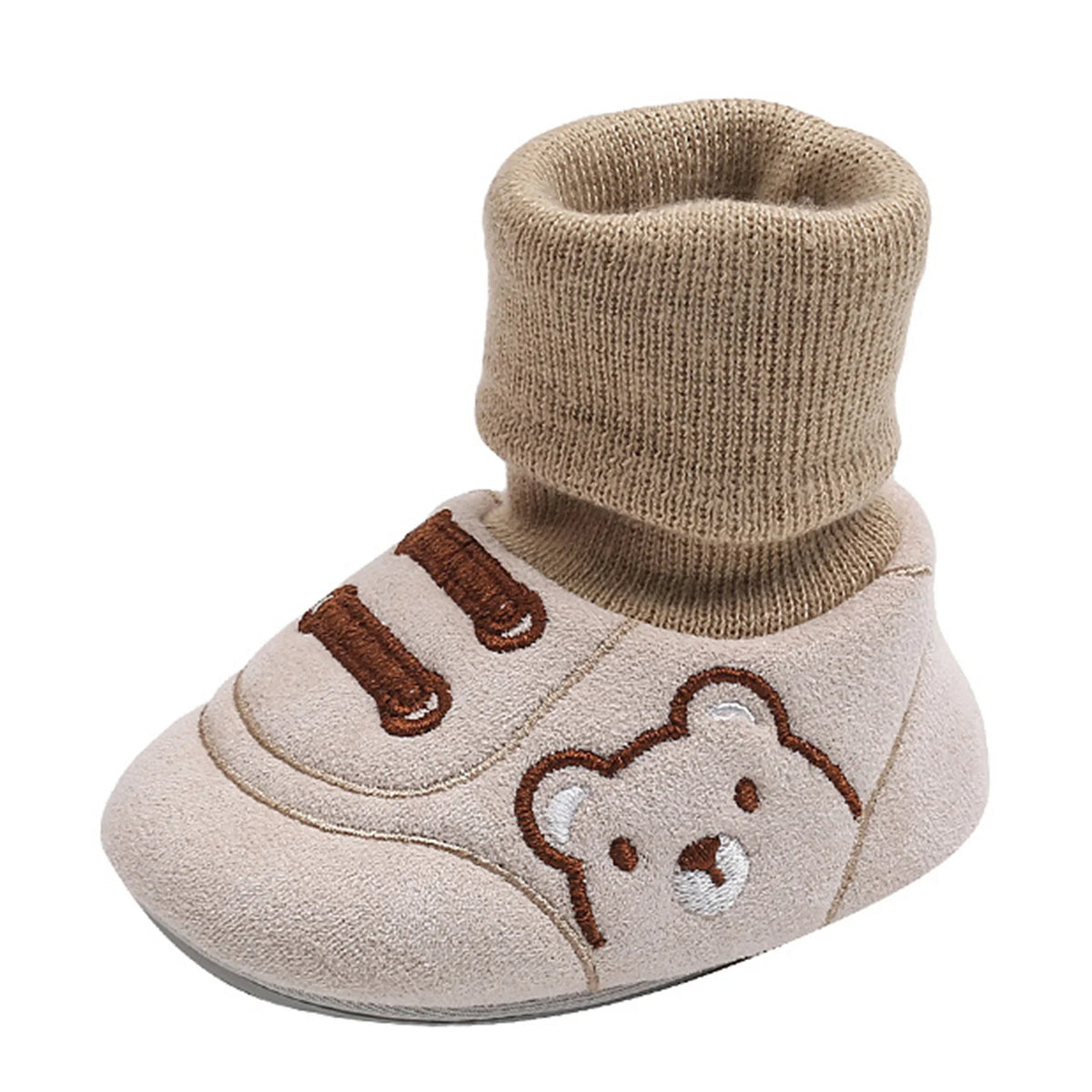 A pair of beige baby soft sole first walker shoes featuring a bear design and knitted cuff.