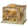 A detailed wooden miniature dollhouse kit featuring a storefront and interior display.