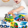 A young child is playing with a set of colorful construction vehicle building blocks, including trucks and machinery.
