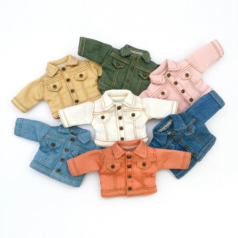 A collection of various colored denim jackets for 1/12 scale dolls, including olive green, tan, pink, and blue.
